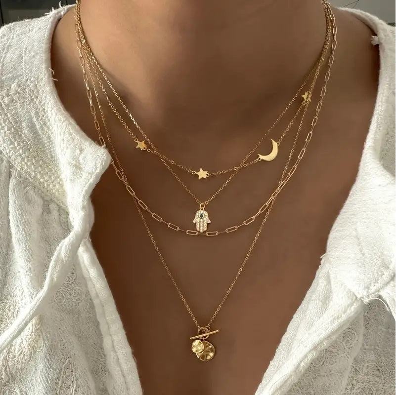 Multi-Strand Golden Tone Charms with Rhinestones Eye Star Moon and Disc Pendant