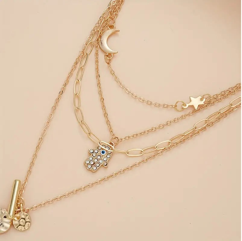 Multi-Strand Golden Tone Charms with Rhinestones Eye Star Moon and Disc Pendant